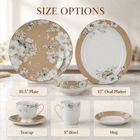 Service de table en porcelaine Bone China avec bordure dorée perlée, motif fleur blanche et feuille verte, comprenant assiette, bol, tasse, soucoupe, mug et plat de présentation