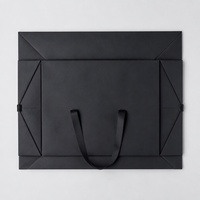 Sac de transport en papier noir personnalisé avec design pliable pour le commerce de détail, les vêtements, les cosmétiques, les bijoux et les emballages cadeaux haut de gamme