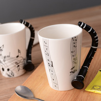 Mug à café en céramique à thème clarinette et notes musicales, style américain créatif, pour le commerce transfrontalier, stock original, mug de voyage