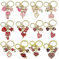 Soododo Série Saint-Valentin transfrontalière Porte-clés en alliage avec pendentif cœur, goutte d'huile et rose, Breloque de sac tendance style femme de bureau