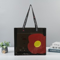 Bolsa de PVC Gris Oscuro Personalizada con Correa Negra y Diseño Floral Transparente para Regalos y Empaquetado Minorista