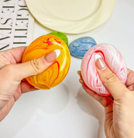 Œuf de Pâques Squishy à Remontée Lente - Jouet à Presser pour Enfants en Sucre de Malt Marbré avec Conception Anti-Stress