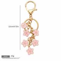 EDGE Porte-clés doré pour sac avec breloque en émail fleur et initiale, breloque de sac tendance pour femme