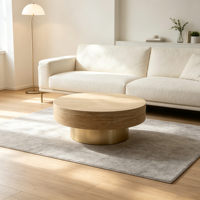 Table basse moderne en bois avec piétement doré champagne, plateau texturé aspect pierre, table centrale circulaire pour salon