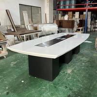 Table de conférence de bureau à bord rond Table de conférence de forme ovale à jambe noire à 12 sièges fabriquée à Guangdong