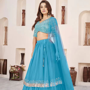 Lehenga bleu fluide et moderne, confectionné en géorgette douce, bordure en dentelle richement ornée de sequins argentés, élégance royale et brillance pour mariage, prix de gros - Product Image 1