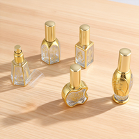 Flacon compte-gouttes en verre pour huile essentielle 15 ml avec logo personnalisé, bille roulante dorée électroplaquée et bouchon à vis scellable anti-UV
