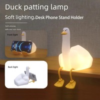 Haute qualité mignon allumer canard canard lampe Silicone LED pépinière veilleuse support pour téléphone portable LED Squishy canard veilleuse