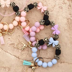 Silicone Beaded <b>Keychain</b> Bracelet With Daisy Charm And Carabiner Clasp In Pastel Colors - Product Image 4
