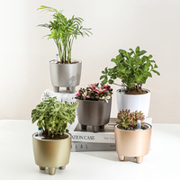 Pots de plantes circulaires en plastique avec pieds, moulage direct, processus de peinture par pulvérisation, design minimaliste moderne pour la maison et le bureau