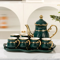 Nouvel ensemble de thé de luxe en céramique, peint à la main, doré, service à eau, théière et tasses en porcelaine pour le thé de l'après-midi, ensembles de café et de thé