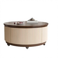 Table basse ronde élégante avec côtés cannelés, mécanisme de levage et rangement intégré