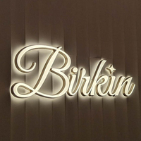 Logotipo personalizado Mini retroiluminado titanio oro resina letras Acero inoxidable LED puerta cabeza publicidad signo iluminado cartelera
