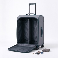 Valise à roulettes souple grise et turquoise avec compartiment avant zippé, deux poches en filet et poignée télescopique