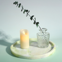Plateau rond moderne et élégant en marbre naturel avec motif floral pour l'organisation de la vanité de la salle de bain et la présentation de bijoux