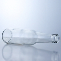Bouteille de bière en verre transparent avec bouchon couronne, surface lisse, fabrication en gros