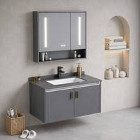 Ensemble de salle de bain moderne de luxe léger en aluminium avec vasque en céramique grise en pierre frittée, miroir LED et armoire murale pour hôtel et villa