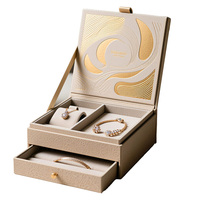 Boîte à bijoux haut de gamme à double couche avec tiroir, texture gaufrée or, papier spécial coloré transparent, boîtes de support intérieures en MDF