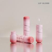 Nouveau Style en gros 2in1 8.3ml Logo personnalisé mignon Unique forme ronde rose clair blanc vide brillant à lèvres Tubes