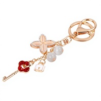 Nouveau porte-clés pendentif en alliage de zinc avec pierre œil-de-chat et trèfle à quatre feuilles, style coréen exquis et tendance, breloque de sac ou de voiture