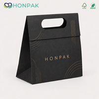 Maßgefertigte Schwarze Faltbare Papier-Geschenktüte mit Gestanztem Griff Gold-Logo Luxus Einzelhandelsverpackungstasche HONPAK