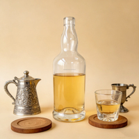 Bouteille en verre rond en flint de 700 ml et 750 ml, durable, disponible en stock, pour spiritueux distillés, whisky, tequila, vodka avec bouchon en liège
