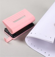 Perforatrice manuelle pour fournitures de bureau Mini Macaron Perforatrice pour papier à feuilles mobiles de bonne qualité