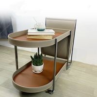 Table d'appoint mobile en cuir avec rangement, style luxe léger, pour salon, en acier inoxydable, petite table basse