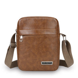 JINGPIN กระเป๋าสะพายข้างผู้ชายหนัง PU กระเป๋าสะพายเดินทางสำหรับธุรกิจสีน้ำตาลสีทึบสวมใส่ได้ทุกวันทนทานต่อการสึกหรอ - Product Image 1