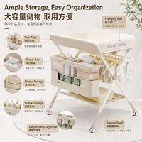Station de change portable pour bébé avec roulettes, grand panier de rangement et support pour baignoire pour les soins des nouveau-nés
