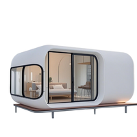 Maison conteneur modulaire en acier pliable moderne, type Apple Cabin, utilisable comme hôtel, entrepôt, bureau ou logement.