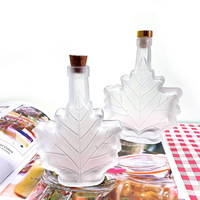 Bouteille en verre en forme de feuille d'érable 50ML 100ML 250ML pour sirop d'érable, mini bouteille transparente pour spiritueux, vodka, whisky avec bouchon à vis