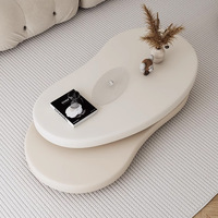 Table basse ovale en bois minimaliste moderne avec plateau rotatif, bords arrondis, structure en acier inoxydable, plateau de type panneau, meuble robuste