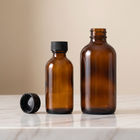 Bouteilles en verre ambré Boston rondes rechargeables en gros avec bouchons à vis pour l'emballage d'huiles naturelles pour les soins de la peau, des cheveux et du corps