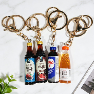 Porte-clés en résine transparente personnalisable en forme de bouteille de bière Lost Coast, cadeau moderne et minimaliste - Product Image 3
