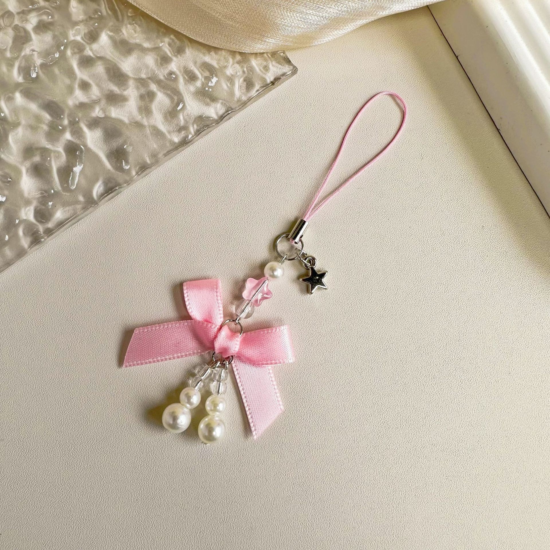 Noeud de perles rose Xc-24a41