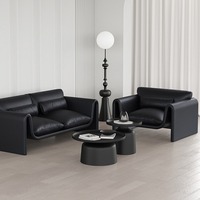 Fauteuil incurvé à profil bas avec coussin d'assise épais et coussin lombaire, chaise longue moderne pour la maison, le salon ou la salle d'hôtel