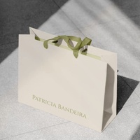 Sacs shopping en papier blanc crème de luxe avec logo personnalisé imprimé et poignées en ruban de satin vert pour boutique de détail