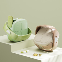 Boîte à médicaments moderne minimaliste rotative Jamie avec compartiments couverts, design color block, portable, grande boîte de rangement à emporter