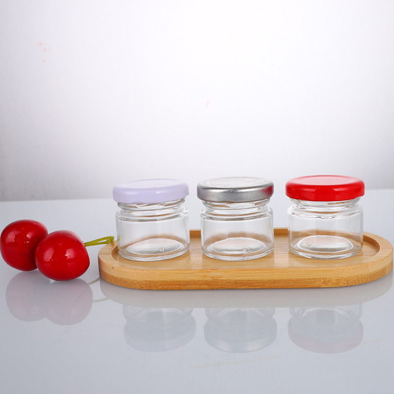 Wholesale Transparent Mini Round Glass Jar With Screw Lid for Kitchen Jam and Spice Storage 25ml 35ml 50ml 70ml