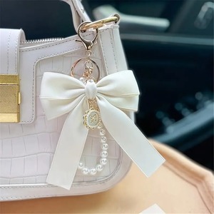 Élégant Mignon Arc Sac Charme Faux Perle Perlé Bracelet Téléphone Longe Sangle De Voiture Marque Porte-clés Cadeaux Fête Des Mères