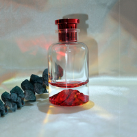 Vente en gros de 30 à 100 millilitres de flacons de parfum ronds en forme de montagne rouge avec couvercles en métal et acrylique