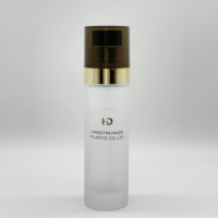 Offre spéciale couvercle en croix dorée couvercle semi-transparent noir bouteille en verre dépoli pompe à lotion