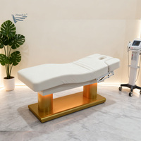 Table de soin électrique à quatre moteurs avec base en tissu imitation bois, réglable en hauteur, pour spa, soins du visage, extensions de cils et massage