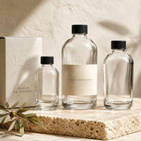 Vente en gros de flacons pompe en verre transparent Boston Round de 250 ml et 500 ml pour les marques privées de savon liquide et de gel lavant pour les mains