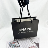 Sac à provisions épais en papier cartonné de luxe à la mode avec logo personnalisé imprimé personnalisé pour magasin de détail de vêtements
