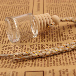 Botella de Perfume de vidrio ecológica de 5ml y 8ml con forma de cilindro transparente con tapón de rosca de madera para colgar ambientador de coche - Product Image 1