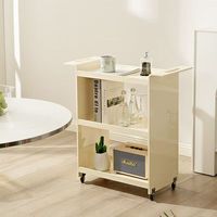 Chariot de présentation moderne et minimaliste en acrylique transparent, écologique, amovible, à 4 roues, pour l'expérience d'échantillonnage en magasin de cosmétiques