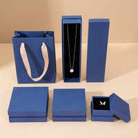 Ensemble d'emballages de bijoux bleu marine : Boîtes et sacs à poignée en ruban, doublés de velours, pour boutiques de cadeaux, usine OEM ODM sur mesure