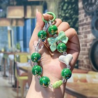 Chaîne de perles colorées en forme de cœur avec nœud - Accessoire mignon et tendance pour sacs de filles, coques de téléphone, etc.